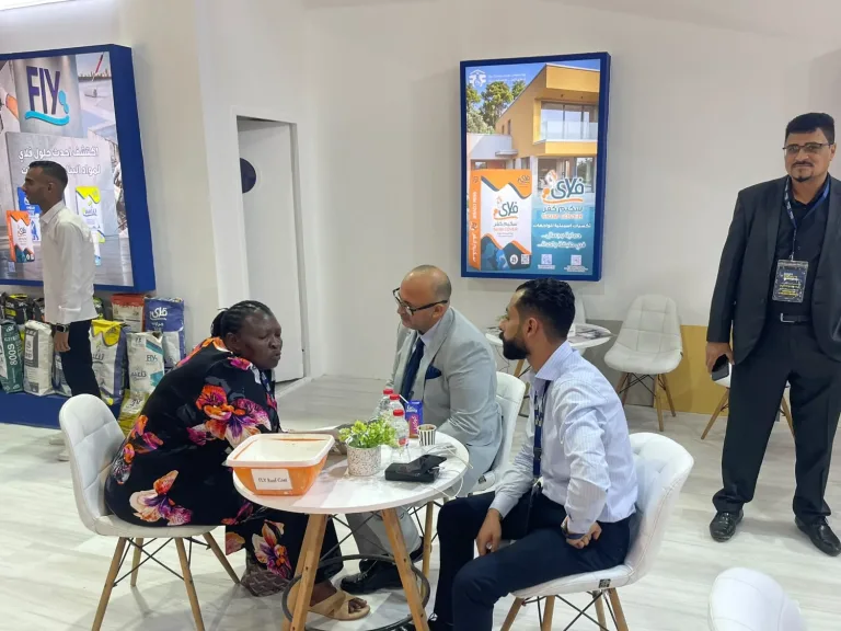 Fly team discussing Fly Roof Coat with a visitor at Egypt Projects 2026